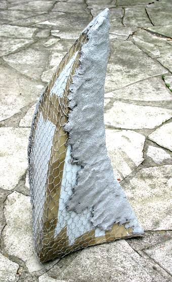 layers being built up over mesh, over plastic form